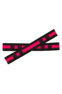 ARMY OF MEN black and fluro pink leather Universal X harness front straps with black snaps, laid flat and viewed from above.