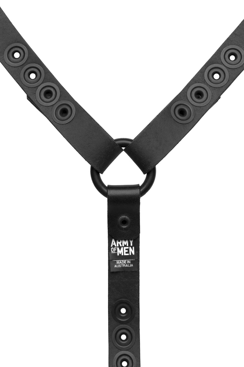 Rear view of an original ARMY OF MEN black veg tan leather head harness base, with matte black snaps, rivets, and O-rings.