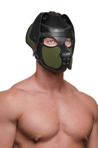 Three quarter view of a male model from the chest up, dressed only in a leather pup hood, with army green ears and snout.