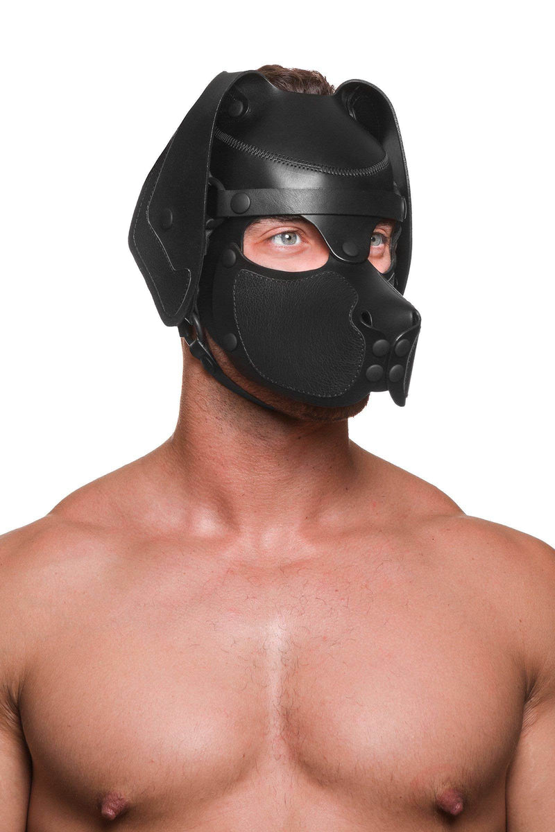 Male model in an ARMY OF MEN black leather RANGER pup hood, with matte black O-rings, rivets and snaps. Three-quarter pose.