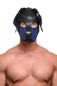 Facing the camera, the model is wearing a distinctive ARMY OF MEN black and blue all-leather pup hood, with black hardware.