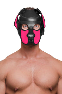 Shirtless man in an adorable ARMY OF MEN leather pup hood, with fluorescent pink ears and snout, and matte black hardware.