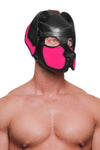 Framed chest-up at a subtle diagonal, the muscular male model is styled in a leather pup hood, with neon pink ears and snout.