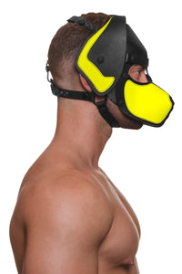 Captured from the side view, a muscular model in an Australian made all leather pup hood with neon yellow snout and ears.