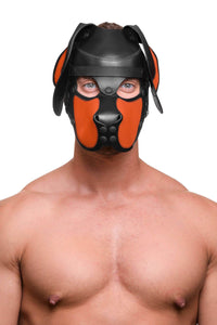 Woof. Athletic male model facing forward in a black and orange leather pup hood with durable matte black metal hardware.