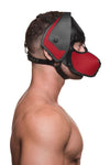 A side-profile of a fit model in a black and red leather ARMY OF MEN pup hood, with matte black O-rings, snaps and rivets.