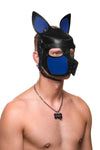 Cutely posed model in an ARMY OF MEN leather SCOUT pup hood, featuring blue snout and ears, and black metal hardware.