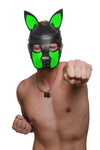 POW! Cheeky model in a black veg tan leather SCOUT pup hood with neon green ears and snout, punches his left fist in the air.