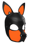 Three-quarter view of an Australian made leather pup mask with fluorescent orange ears, and matte black rivets.