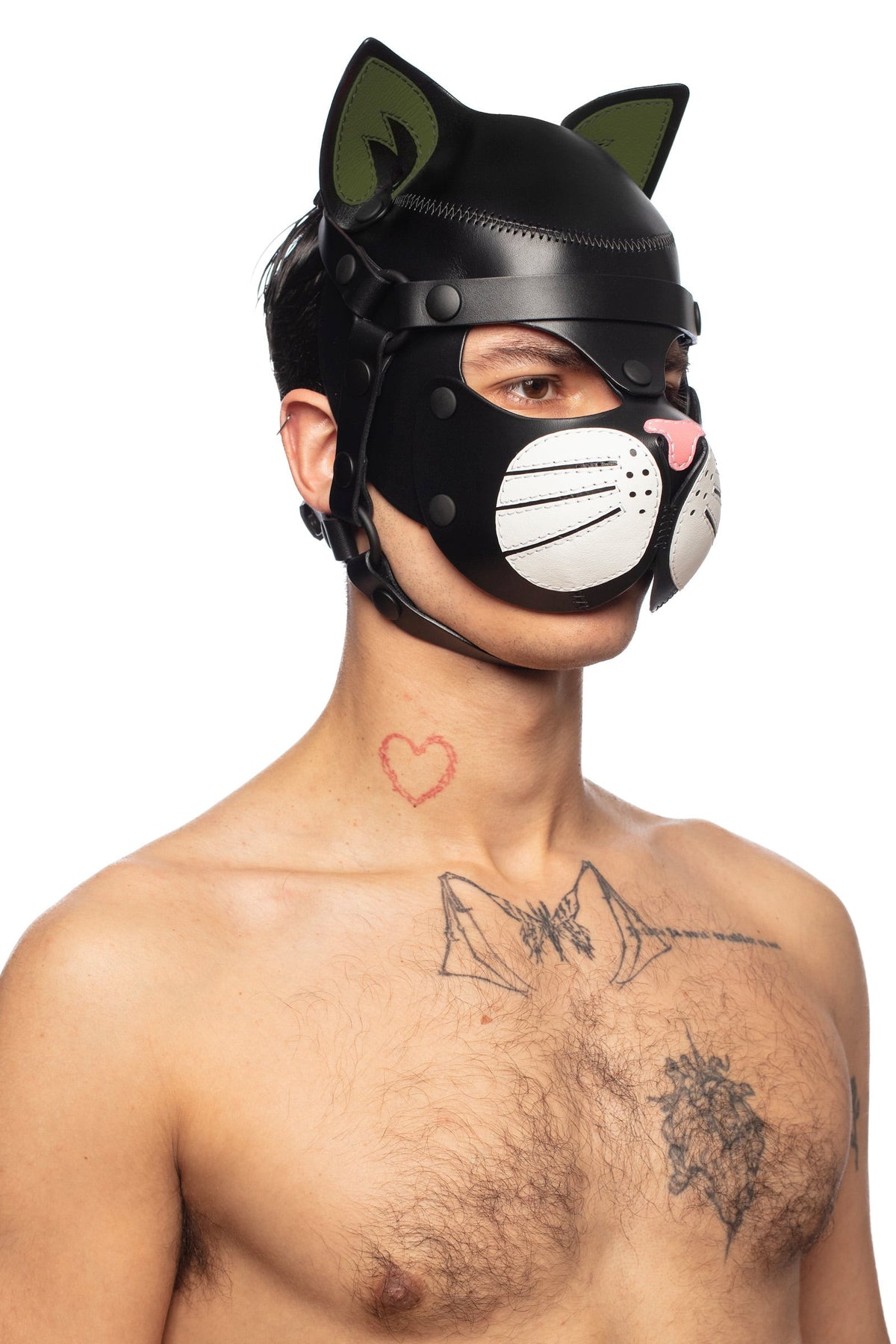 Male model from the chest up, dressed only in a leather cat hood, with army green ears, white whisker pads and pink nose.