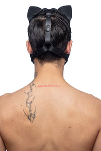 The back view of a model posing in an ARMY OF MEN cat hood, featuring hard-wearing matte black metal rings and snap caps.