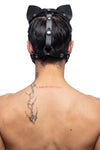 The rear view of our model wearing an ARMY OF MEN TOMCAT hood, with durable stainless steel metal rings and snap caps.