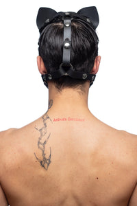 The rear view of our model wearing an ARMY OF MEN TOMCAT hood, with durable stainless steel metal rings and snap caps.