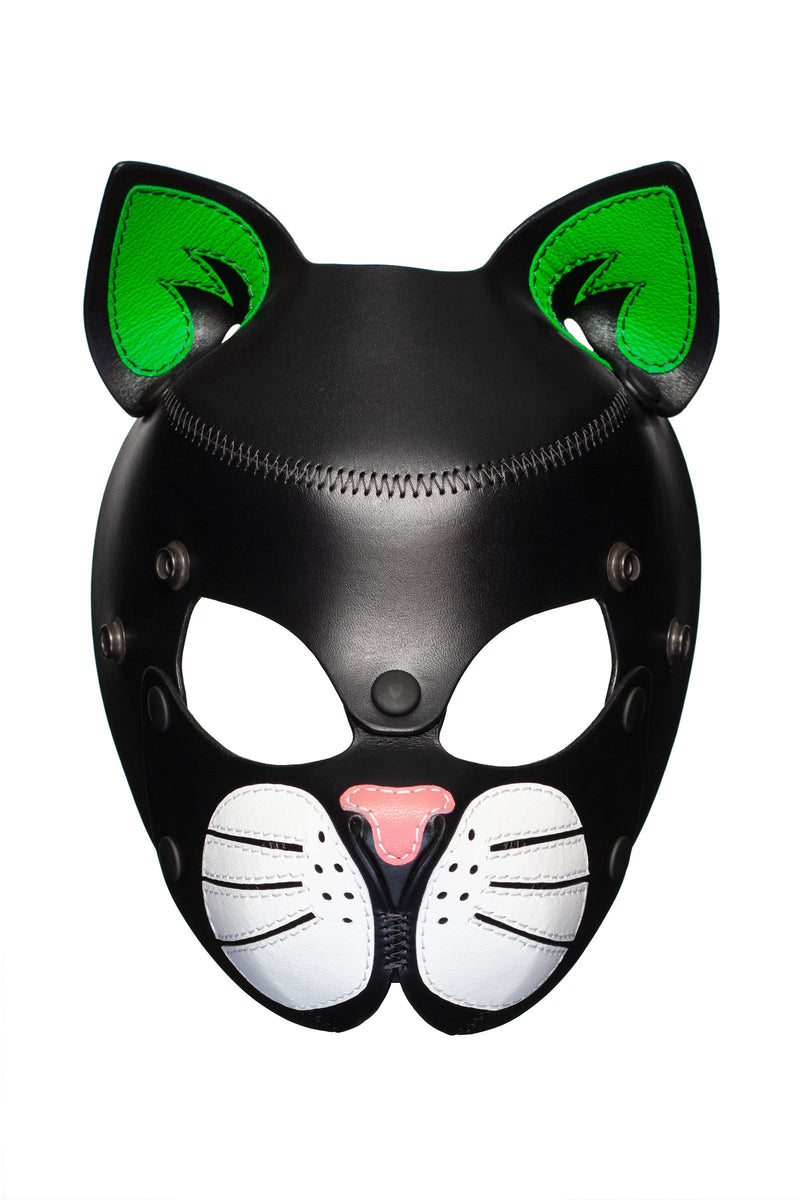 Front-facing TOMCAT mask with neon green ears and soft pink nose.