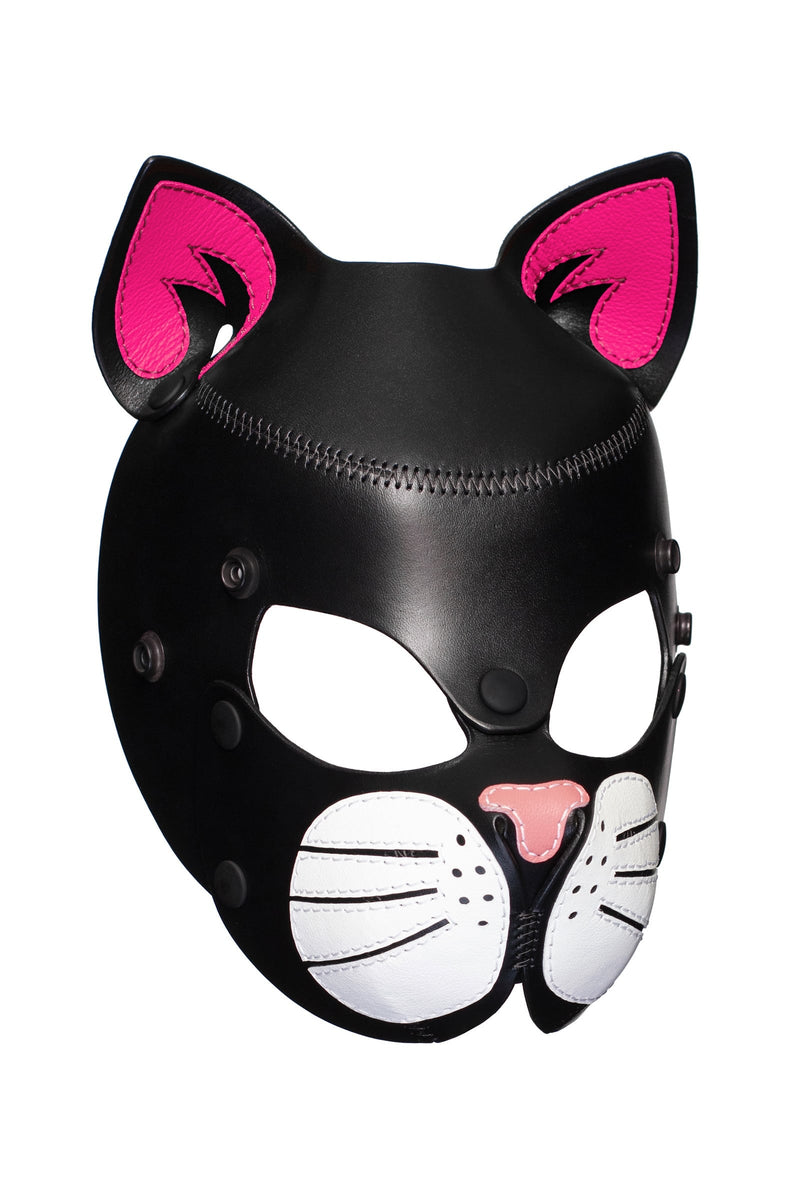 Three-quarter view of TOMCAT mask with fluorescent pink ears and white whisker pads.