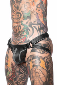 ARMY OF MEN COMBAT JOCK - Grey with matte black metal hardware, styled on a striking model, seen in a three-quarter profile.