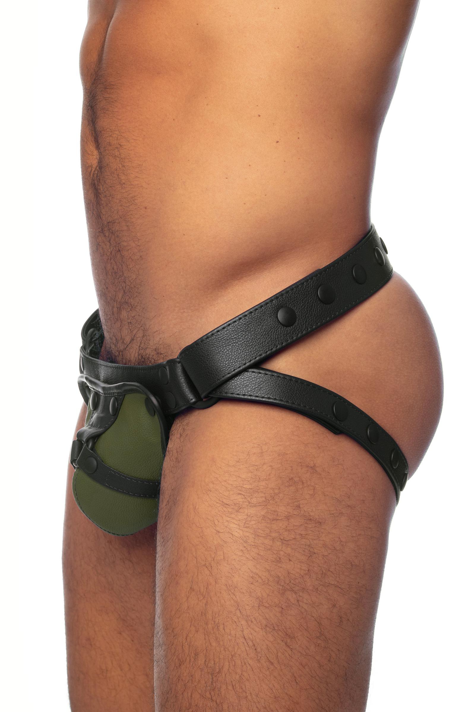 Black leather jockstrap with army green and black leather harness codpiece. Side view.