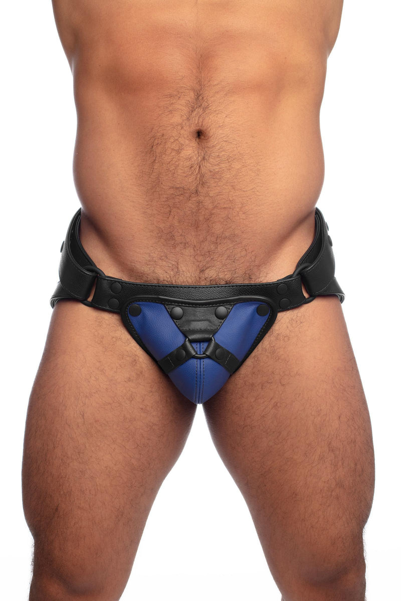 Front view of a model in a black and blue leather jock with harness detailed codpiece.