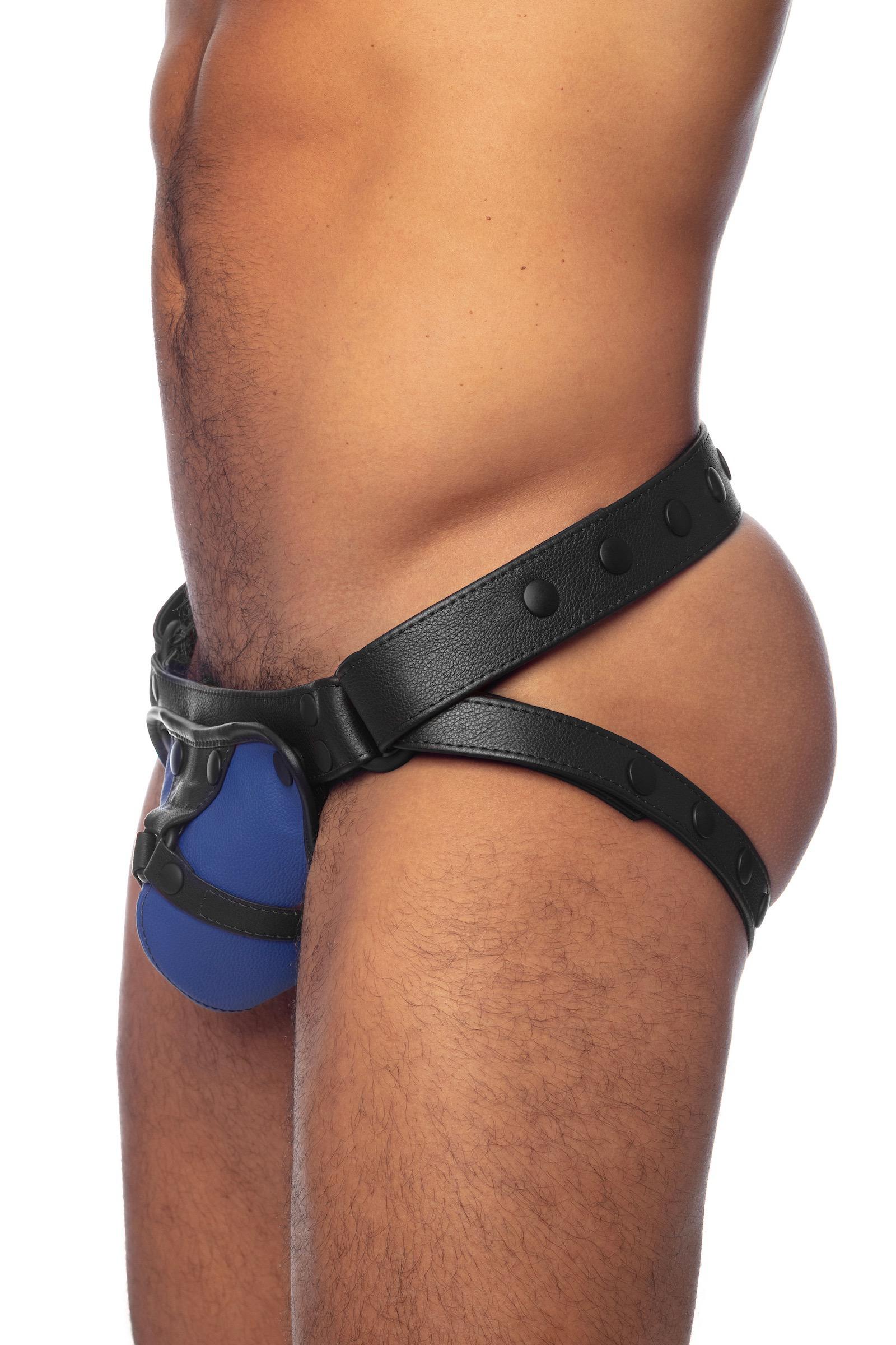 Side view of a model in a blue and black leather jock with harness detailing.