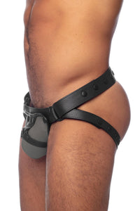 Side view of a model in an grey and black leather jockstrap with detectable codpiece.