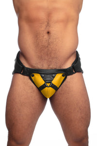 ARMY OF MEN yellow and black jock with harness detailing on a model facing forward.
