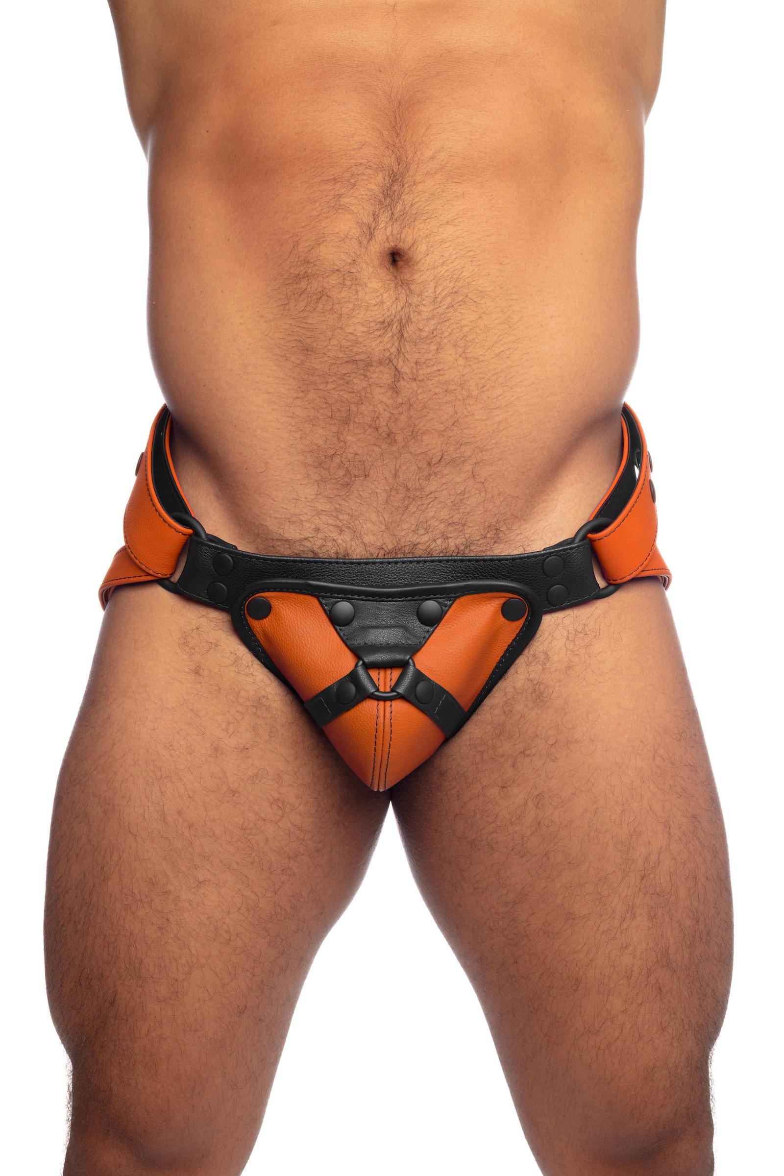 Front-on model wearing an orange and black leather jockstrap.