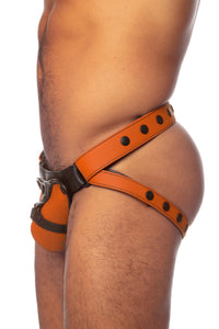 Side view of a model in an orange and black leather jock with harness detailed codpiece.