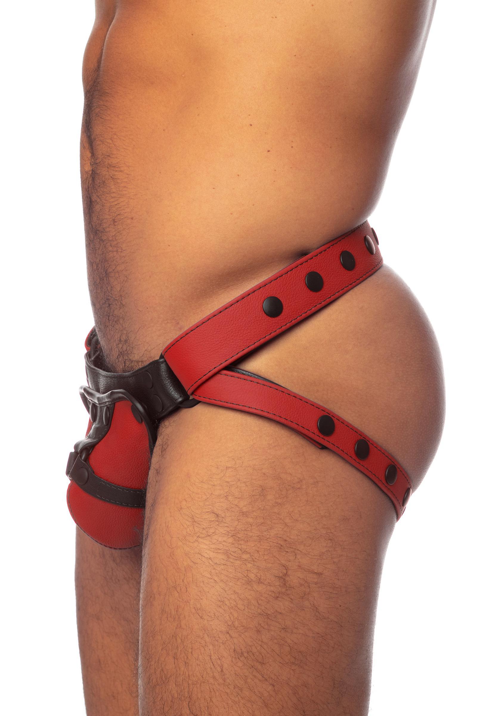 ARMY OF MEN red and black leather jock on a bulging male model. Side view. 