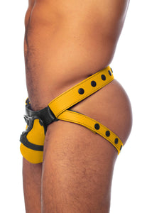 Model in a yellow and black jock with  harness detailed codpiece. Side view.
