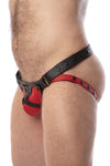 Side view of model wearing a black and red leather jockstrap with harness detail on codpiece