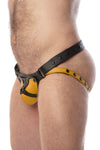 Side view of model wearing a black and yellow leather jockstrap with harness detail on codpiece