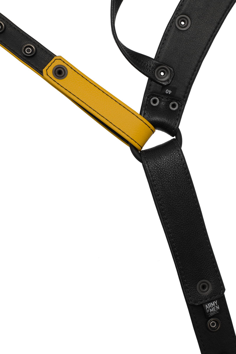 Flat view of lining side of a black and yellow leather jockstrap
