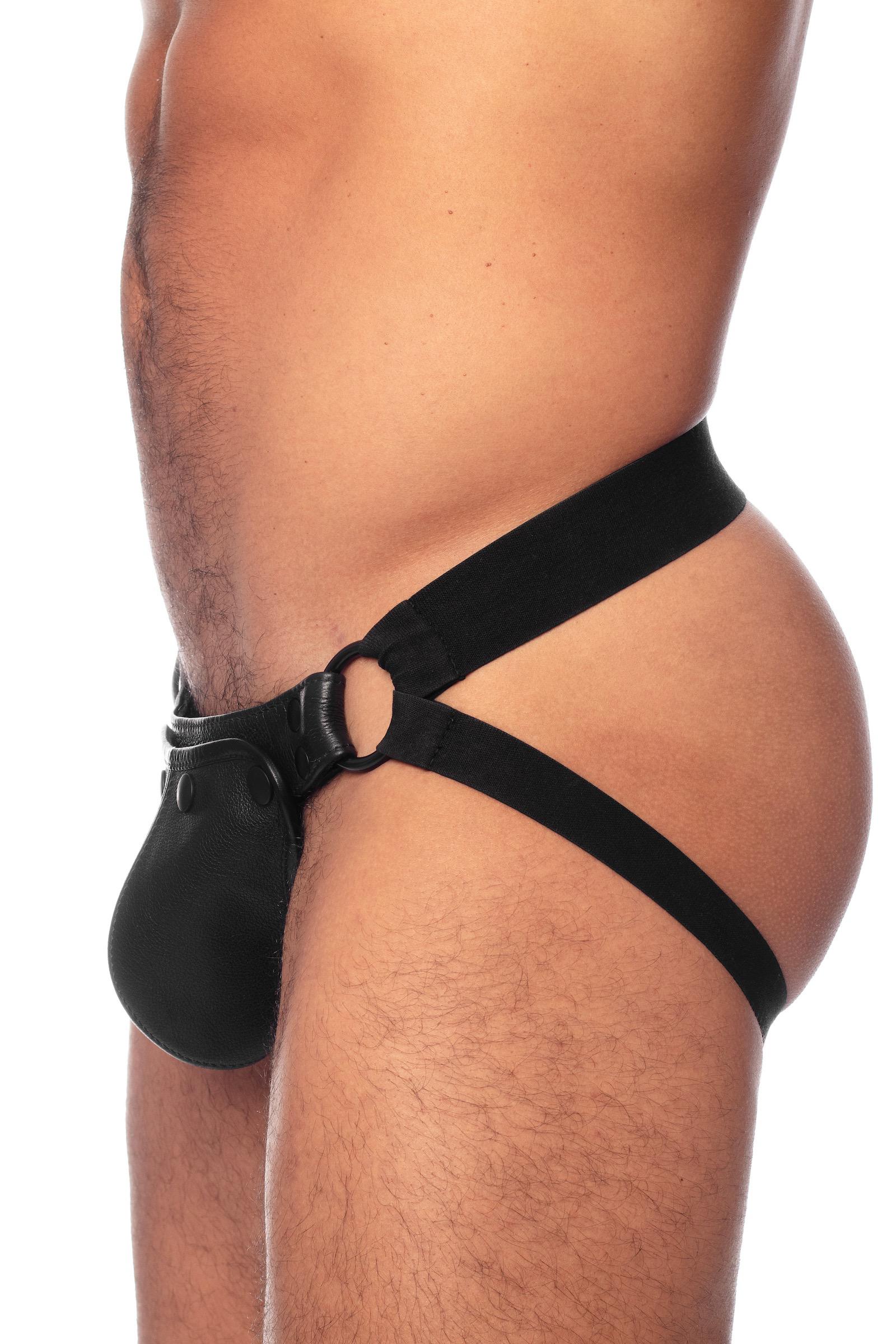 Side view of male model wearing a handcrafted ARMY OF MEN HYBRID JOCK - Black with matte black hardware.