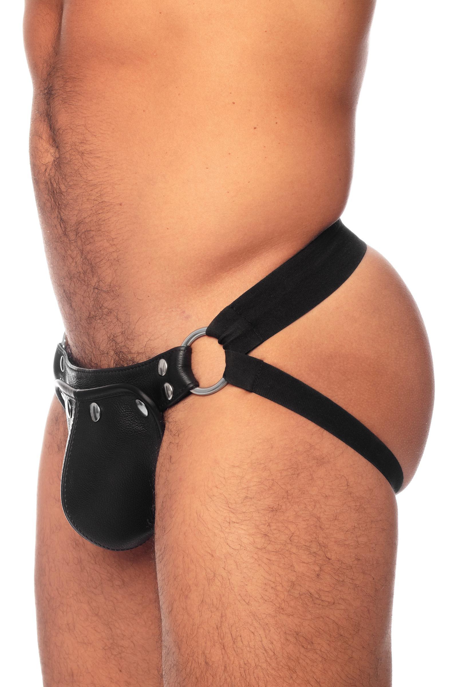 Side view of male model in an Australian made black elastic and leather hybrid jockstrap with stainless steel metal hardware.