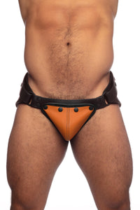 Male model in a black leather jockstrap with orange codpiece. Front view.