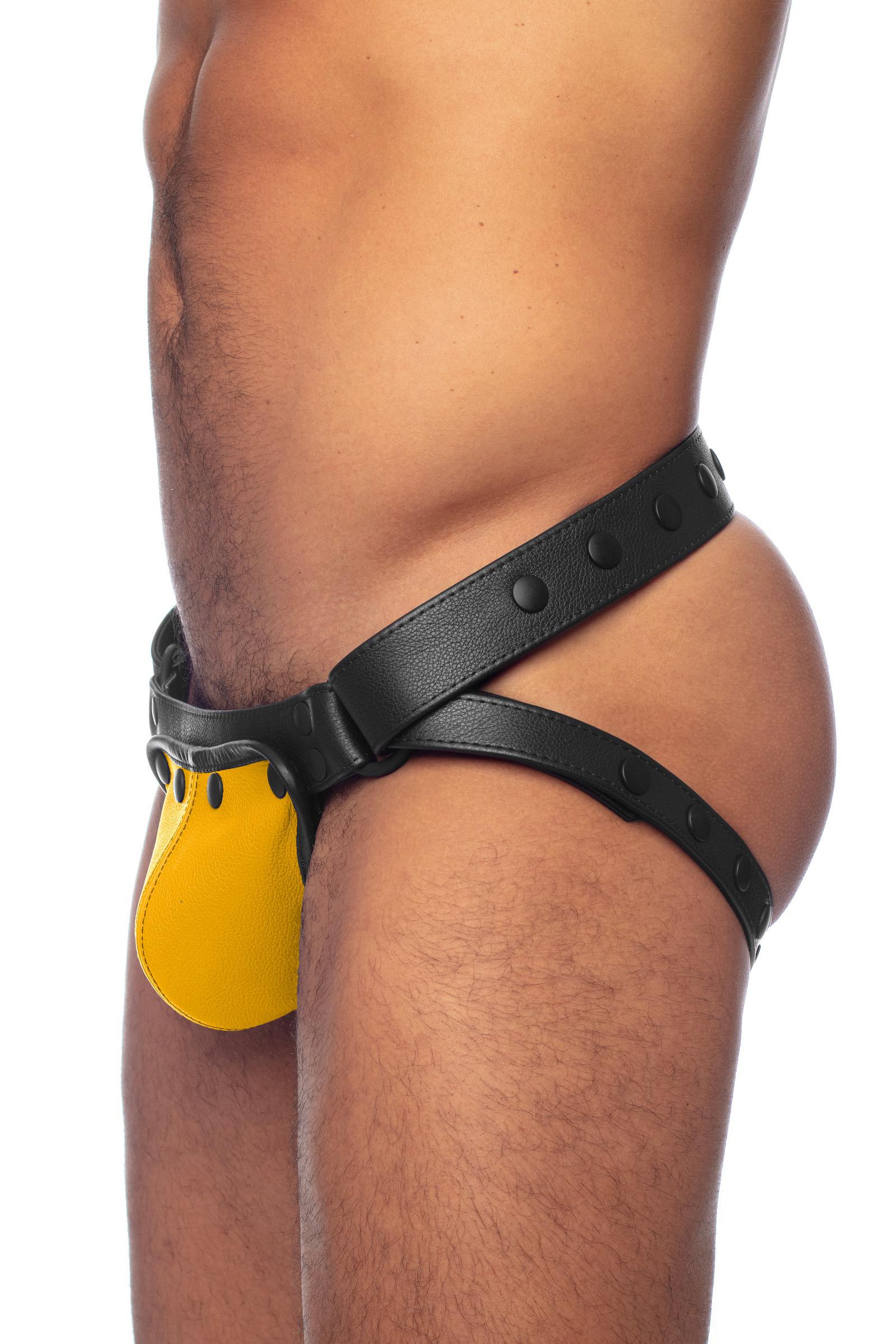 Side view of a male model wearing a black and yellow leather jock.