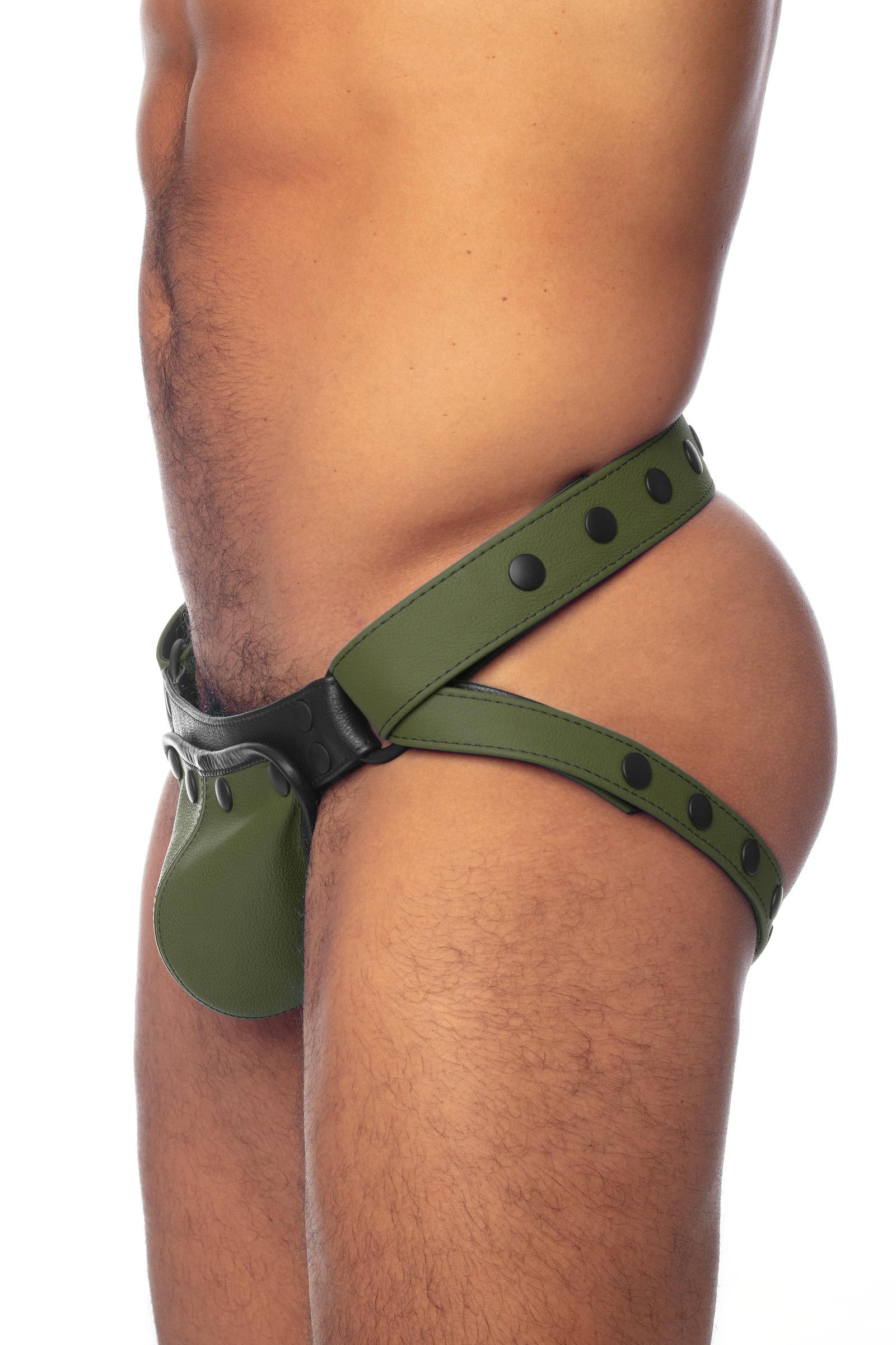 An army green leather jockstrap worn by a solid male model. Side view.