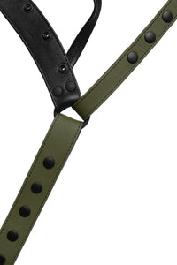 The front of an army green leather jockstrap. Close-up view.