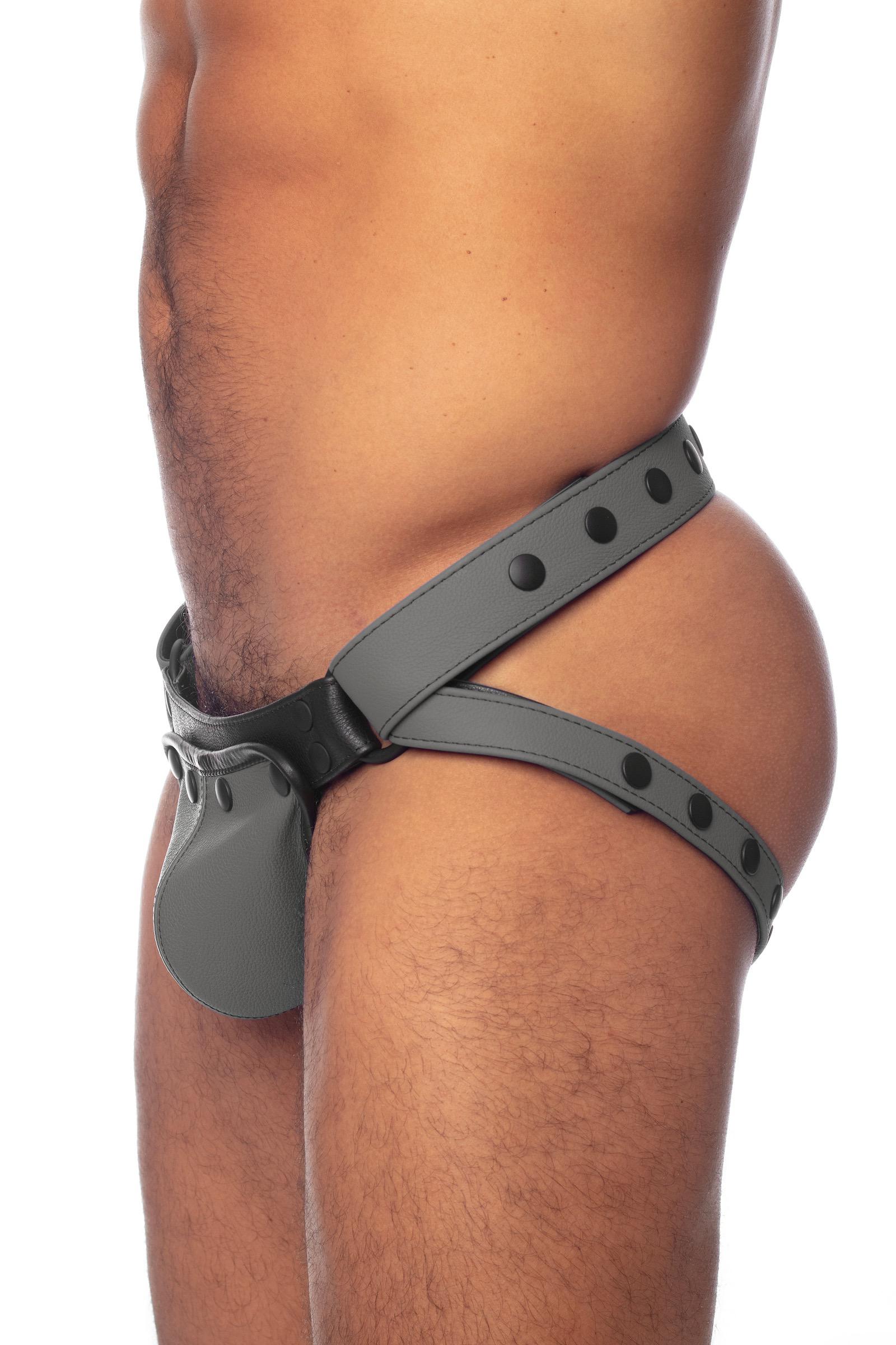 Grey leather jockstrap on a thick male model turned side-on.