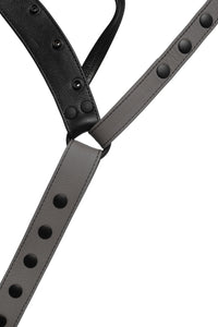 Detailed view of the front of a grey leather jockstrap.