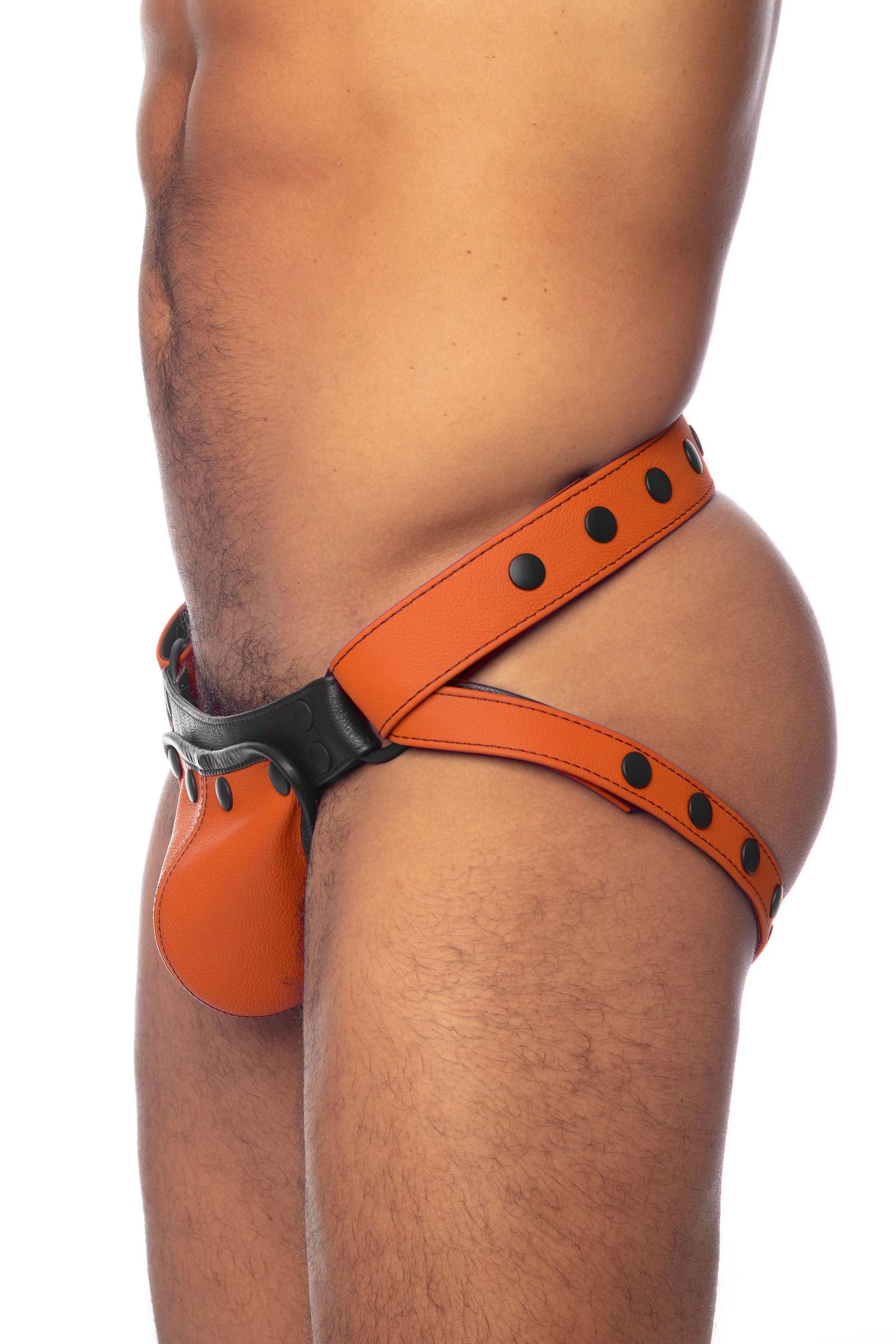 An orange leather jock on a thick male model. Side view.