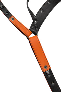 Detailed view of the lining of an orange leather jockstrap.