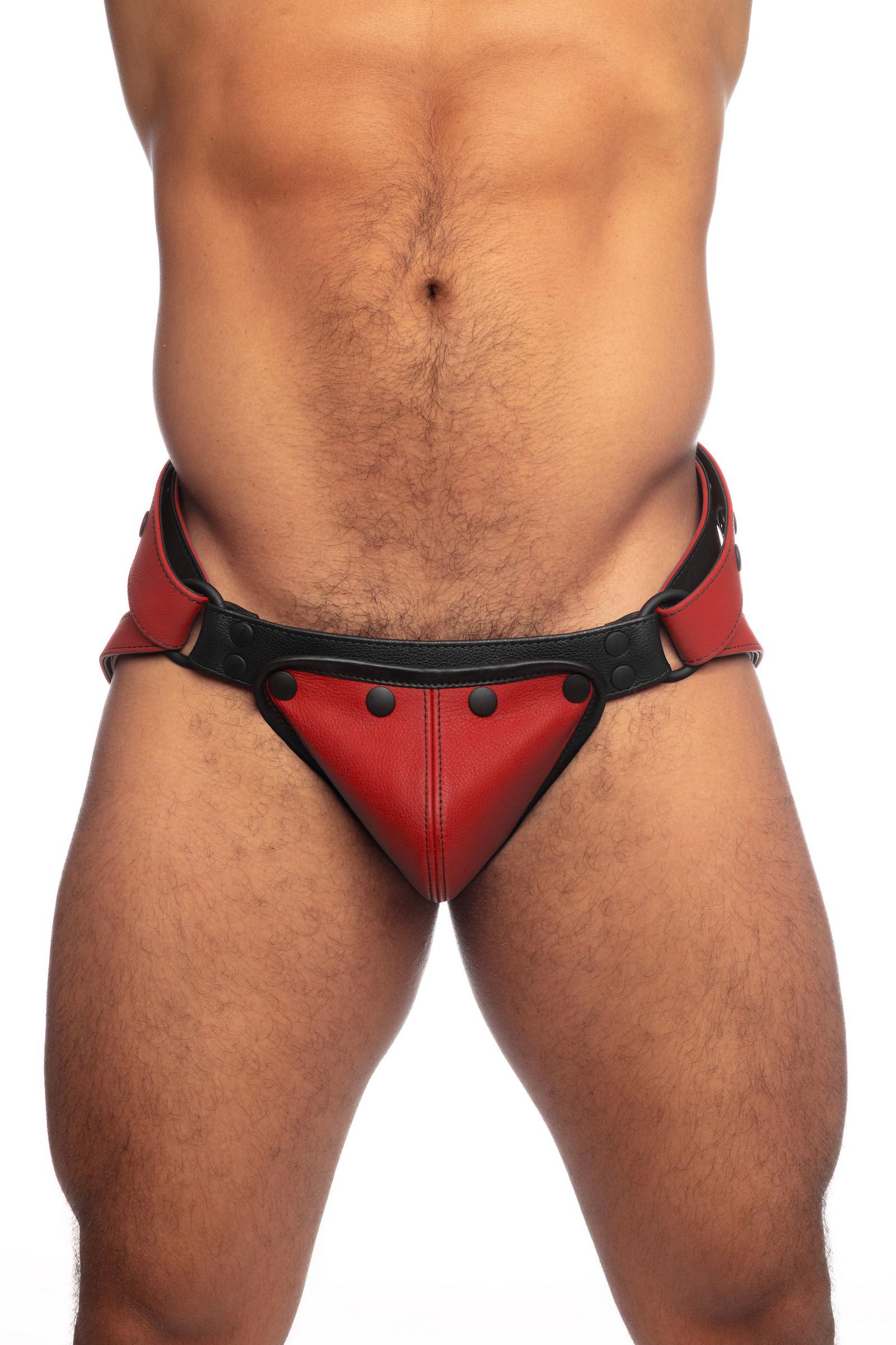 Red leather jock on a muscular made model. Shown from the front.