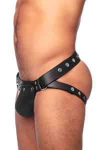 Male model wearing black leather jockstrap with stainless steel hardware. Side view.