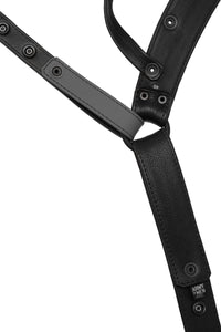 Flat view of lining side of a black and grey leather jockstrap