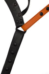 Flat view of front side of a black and orange leather jockstrap