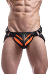 Male model facing forward in a handmade ARMY OF MEN FLURO STRIPE JOCK - Fluro Orange with black snaps, rivets, and O-rings.