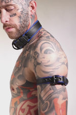 Model wearing a narrow 1" black and blue leather armband belt
