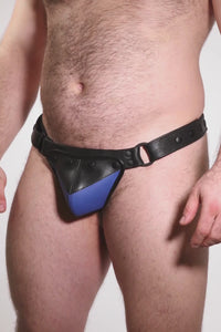 Video of a model wearing a black leather thong with a blue shadow codpiece. Matt black hardware