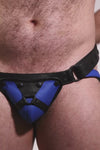 Video of a model wearing a black and blue leather jockstrap with harness detail on codpiece